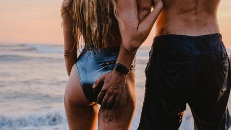 Romantic Beach Sunset with Couple in Love wallpaper