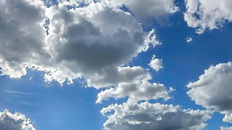 Fluffy Dreams in a Bright Sky wallpaper