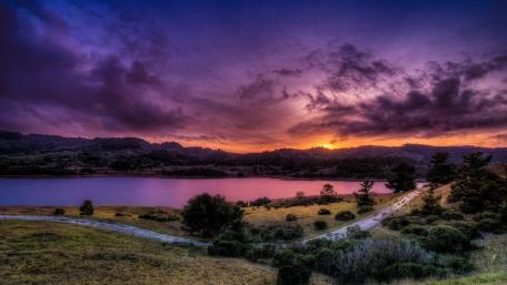 Purple Dusk Over Tranquil Lake wallpaper
