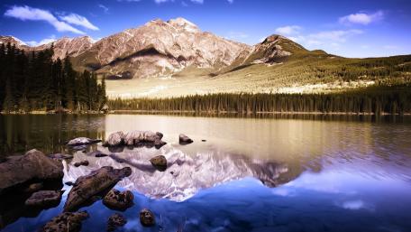 Mountain Majesty Reflecting on Tranquil Waters wallpaper
