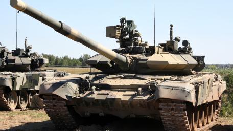 Tank in Action on Rough Terrain wallpaper