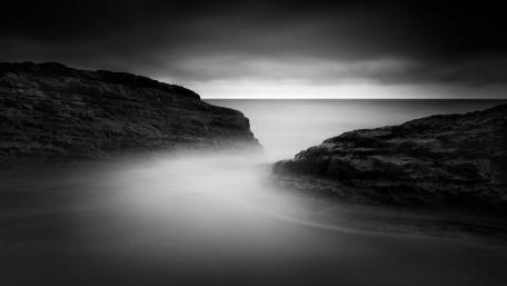 Misty Coastline Serenity in Monochrome wallpaper