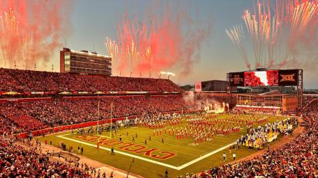 Exciting Football Game Under Fireworks Display wallpaper