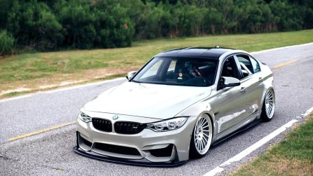 Sleek BMW M3 on a Coastal Road wallpaper