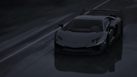 Lamborghini Aventador in Motion on Rainy Night wallpaper