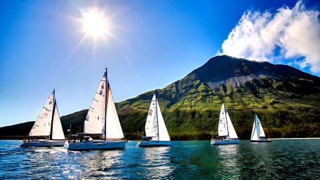 Sailing Adventure Under Sunlit Skies wallpaper