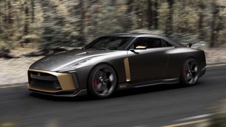 Nissan GT-R50 Speeding through a Forest Road wallpaper