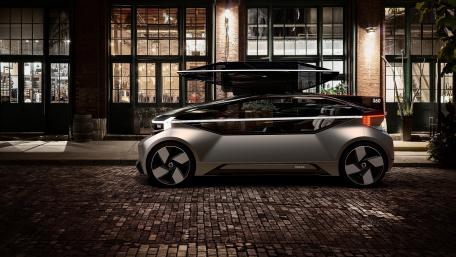 Volvo 360c Futuristic Urban Night Scene wallpaper