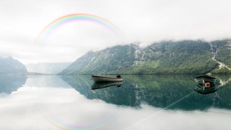 Boat at lake and a rainbow cross over mountains heart wallpaper