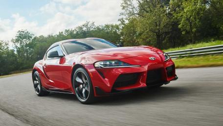 Red Toyota Supra in Motion on Scenic Road wallpaper
