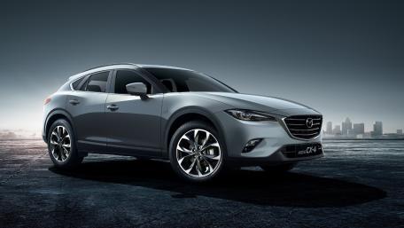 Majestic Mazda CX-70 in Urban Evening Glow wallpaper