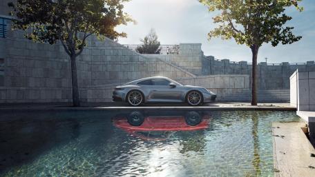 Porsche 911 Elegance by a Reflective Pool wallpaper