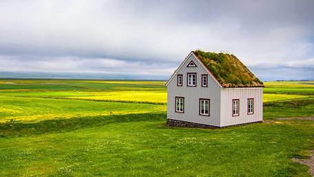 Turf-Roofed Cottage on Icelandic Pasture wallpaper