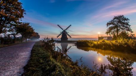 Morning Tranquility by the Mill in Foggy Netherlands wallpaper