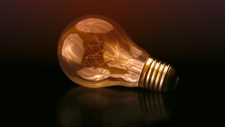 Illuminating Innovation Elegant Light Bulb Display wallpaper