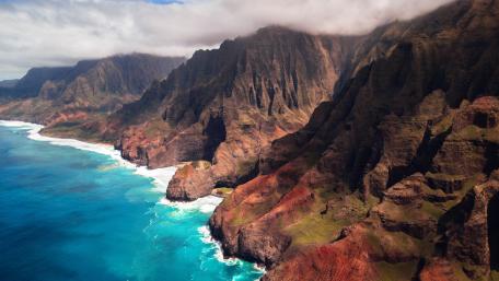Majestic Beauty of Honopu Arch and Nā Pali Coast wallpaper
