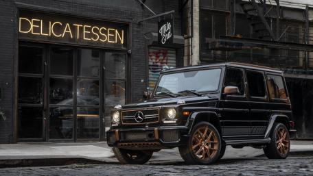Sleek Mercedes-Benz G-Class in a Stylish Urban Scene wallpaper