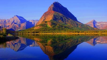 Swiftcurrent Serenity Majestic Reflection at Glacier National Park wallpaper