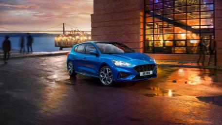 Ford Focus in Urban Sunset Scene wallpaper