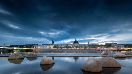 Hôtel-Dieu de Lyon Against a Dramatic Evening Sky wallpaper