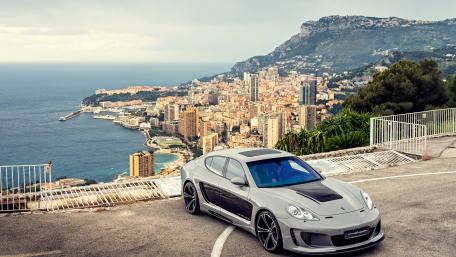 Porsche Panamera Overlooking Coastal Cityscape wallpaper