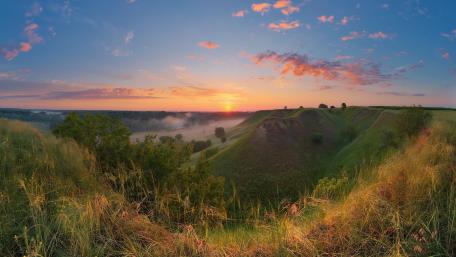 Golden Dawn Over Rolling Hills wallpaper