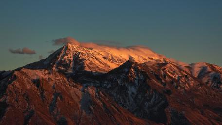 Majestic Snow-Capped North Timpanogos Bathed in Sunset Light wallpaper