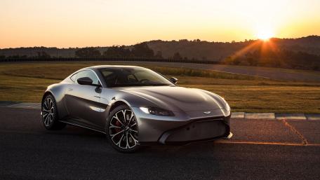 Sleek Aston Martin Vantage Sunrise Drive wallpaper