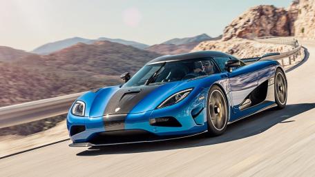Sleek Hypercar on Scenic Mountain Drive wallpaper