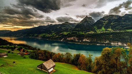 Serene Mountain Reflections at Lungernsee Lake in Switzerland wallpaper