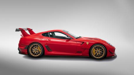 Sleek Red Supercar on Minimalist White Background wallpaper