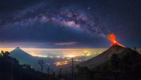 Majestic Volcano Under a Starry Sky wallpaper