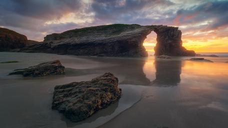 Majestic Evening Glow at As Catedrais Beach wallpaper