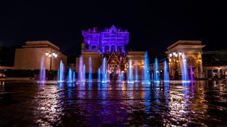 Vibrant Fountain Display Amidst Tokyo DisneySea Nightscape wallpaper