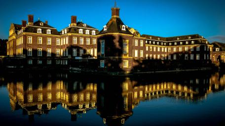 Majestic Reflection of Nordkirchen Castle at Dusk wallpaper