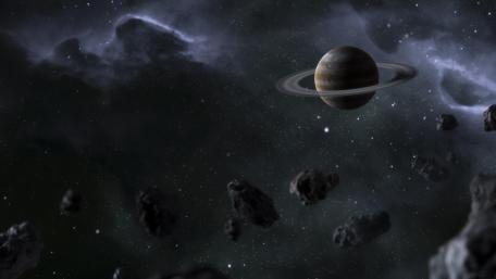 Ringed Planet Amidst Asteroid Chaos wallpaper