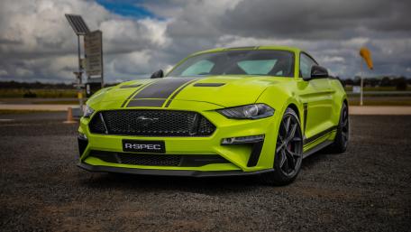 Vibrant Green Mustang on Overcast Day wallpaper