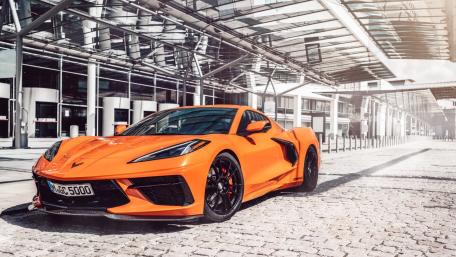 Vibrant Ride An Orange Corvette Dream wallpaper