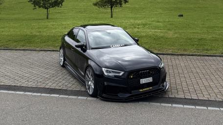 Sleek Audi RS3 Sportback in Urban Setting wallpaper