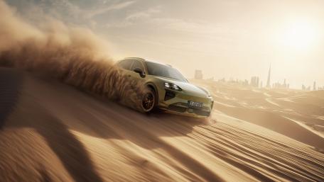 Porsche Cayenne Storming Desert Dunes in Golden 4K Light wallpaper