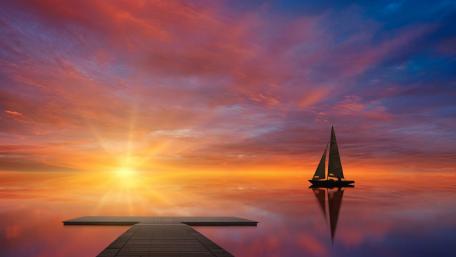Sailboat Silence on a Tranquil Lake at Radiant Sunset wallpaper