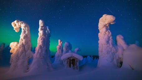 Aurora Over Snowy Lapland Cabin and Frosted Pines wallpaper