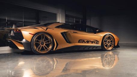 Gold Lamborghini Aventador Under Studio Lights wallpaper