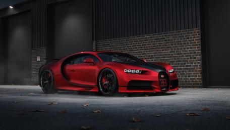 Crimson Bugatti Chiron Night Showcase in Urban Industrial Setting wallpaper