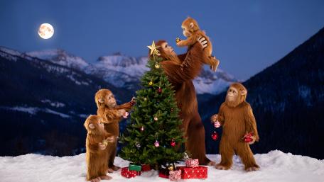 Bigfoot Family Tree Decorating Under Moonlit Mountains wallpaper