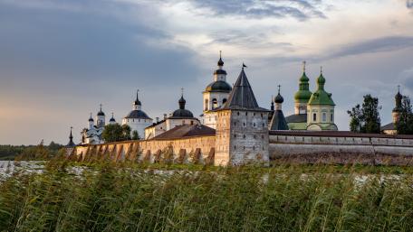 Kirillo-Belozersky Monastery Fortress Reflected by Lake Siverskoye Skies wallpaper
