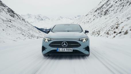 Mercedes-Benz Compact SUV Cutting Through a Snowy Mountain Pass wallpaper