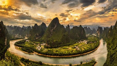 Sunset Over Guilin Karst Peaks and Winding River Landscape wallpaper