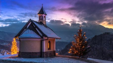 Snowy Kirchleitn Chapel and Christmas Lights at Berchtesgaden Dusk wallpaper
