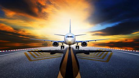 Jetliner Ready for Takeoff at Golden Hour Runway in 4K wallpaper